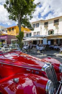 View of red vintage MG car in front of traditional Al Fresco restaurant in old town, Funchal, Madeira, Portugal, Europe Copyright: FrankxFell 844-16296 Editorial Use Only