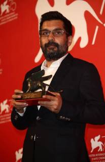 September 8, 2018 - Venice, Italy - Mahmut Fazil Coskun poses with the Special Orizzonti Jury Prize for The Announcement (Anons) at the Winners Photocall during the 75th Venice Film Festival on September 8, 2018 in Venice, Italy. Venice Italy  - ZUMAn230 20180908_zaa_n230_750 Copyright: xMatteoxChinellatox