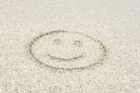 Smiley face drawn in sand at the beach  Copyright: MichèlexConstantini B53599009