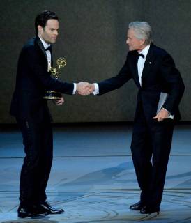 Bill Hader (L) accepts the Outstanding Lead Actor in a Comedy Series award for Barry from Michael Douglas onstage during the 70th annual Primetime Emmy Awards at the Microsoft Theater in downtown Los Angeles on September 17, 2018.  LAP20180917627 JIMxRUYMEN