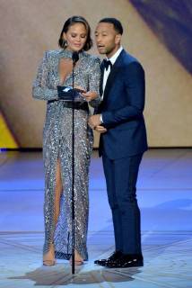 Chrissy Teigen (L) and John Legend speak onstage during the 70th annual Primetime Emmy Awards at the Microsoft Theater in downtown Los Angeles on September 17, 2018.  LAP201809171121 JIMxRUYMEN