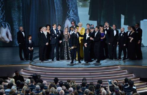 Writer-producers D.B. Weiss (C) and David Benioff (R) and the cast of Game of Thrones accept the award Outstanding Drama series onstage during the 70th annual Primetime Emmy Awards at the Microsoft Theater in downtown Los Angeles on September 17, 2018.  LAP201809172014 JIMxRUYMEN