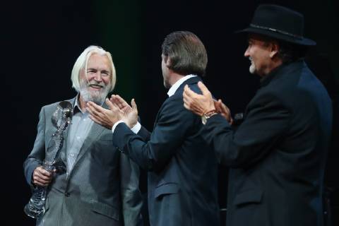 MOSCOW, RUSSIA - OCTOBER 22, 2018: Crystal Turandot Award President Boris Belenky and Vladimir Mashkov, Head of the Oleg Tabakov Studio Theatre, congratulate actor Stanislav Lyubshin (R-L) on winning the Honour and Dignity prize at a ceremony for the 27th Crystal Turandot Award, an independent theatre prize, held at Moscow s Vakhtangov Theatre. Valery Sharifulin TASS  TS094CA6