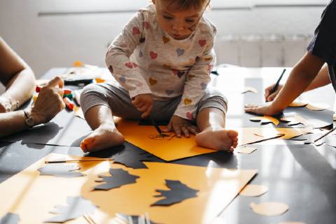 Baby girl painting halloween decoration at home model released Symbolfoto property released  JRFF01892