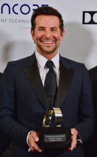Actor Bradley Cooper holds the American Cinematheque Award during a photo-op at the entertainment industries annual gala at the Beverly Hilton Hotel in Beverly Hills, California on November 29, 2018. Bradley was honored as an extraordinary artist in the entertainment industry currently making a significant contribution to the art of the moving picture.  LAP2018112912 JIMxRUYMEN
