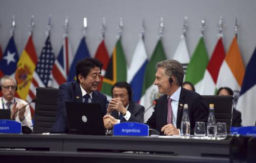 December 1, 2018 - Buenos Aires, Argentina - Argentine President Mauricio Macri, right, shakes hands with Japanese Prime Minister Shinzo Abe, left, during the start of the plenary session on Day Two of the G20 Summit meeting at the Costa Salguero Center December 1, 2018 in Buenos Aires, Argentina. Buenos Aires Argentina - ZUMAp138 20181201_zaa_p138_050 Copyright: xG20xArgentinax