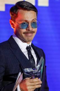 MOSCOW, RUSSIA - DECEMBER 5, 2018: Actor Pavel Derevyanko receibes, winner of the Actor of the Year award, during a ceremony to present the Event of the Year 2018 prize held by the Cinema Reporter magazine at Illusion Cinema. Cinema Reporter is a new magazine that was established by the editorial staff of the Russian version of The Hollywood Reporter magazine. Artyom Geodakyan TASS  TS099F63