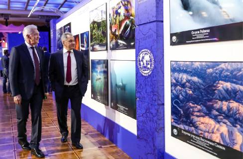 MOSCOW, RUSSIA - DECEMBER 7, 2018: Volga Group owner, businessman Gennady Timchenko (L), and Russia s Defence Minister Sergei Shoigu at an exhibition of the winning entries of the Russian Geographical Society s The Most Beautiful Country photography competition at the State Kremlin Palace, the venue of the 2018 Russian Geographical Society Prize award ceremony. Anton Novoderezhkin TASS  TS09A49A