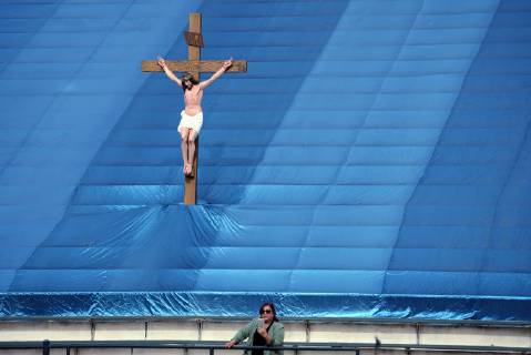 December 9, 2018 - Los Angeles, California, United States - A woman and a statue of Jesus Christ are seen as during the 87th Annual Procession in honor of Our Lady of Guadalupe in Los Angeles, California on December 9, 2018. The Catholic procession is the oldest religious procession in Los Angeles and celebrates the apparition of the Virgin Mary in Mexico in 1531. Los Angeles United States - ZUMAn230 20181209_zaa_n230_551 Copyright: xRonenxTivonyx