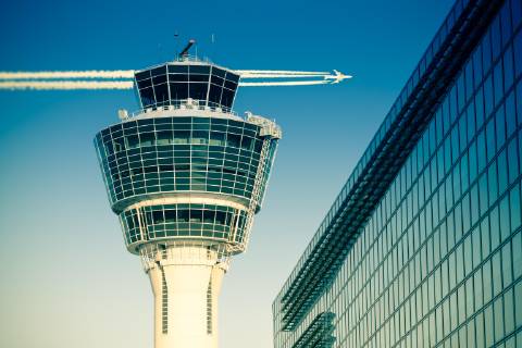 Flights management air control tower passenger terminal and flying plane  Copyright: xservickuzx Panthermedia18064368