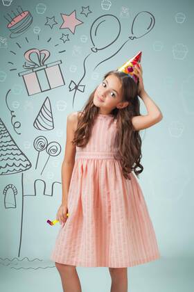  The cute cheerful little girl with festive cap on gray background model released Symbolfoto  Copyright: xmaster1305x Panthermedia19273731