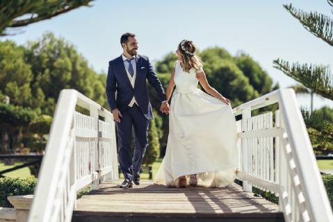 Bridal couple enjoying their wedding day in a park model released Symbolfoto JSMF00570