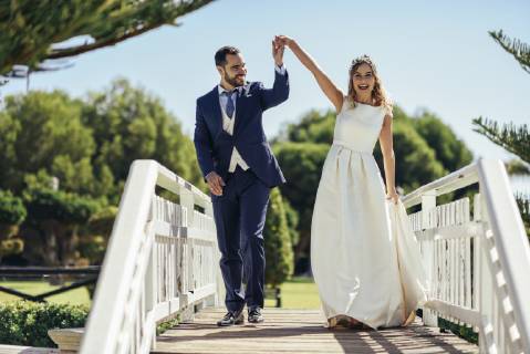 Bridal couple enjoying their wedding day in a park model released Symbolfoto JSMF00571
