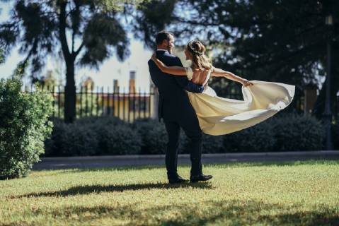 Bridal couple enjoying their wedding day in a park model released Symbolfoto JSMF00565