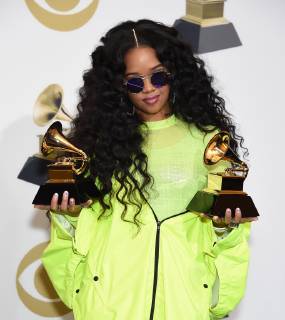 H.E.R. appears backstage with her awards for Best R&B Performance for Best Part, and Best R&B Album for H.E.R., during the 61st annual Grammy Awards held at Staples Center in Los Angeles on February 10, 2019.  LAP201902101044 GREGGxDEGUIRE