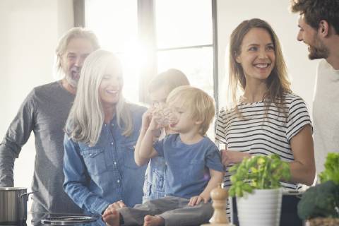 Happy family with grandparents and children standing in the kitchen model released Symbolfoto property released SBOF00511