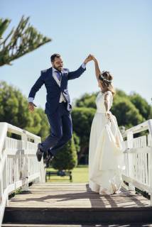 Bridal couple enjoying their wedding day in a park model released Symbolfoto JSMF00572