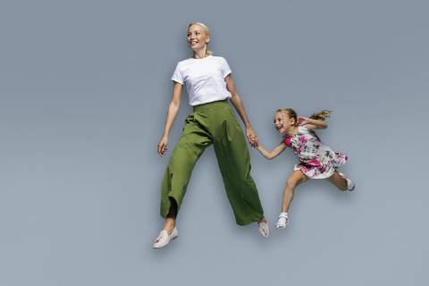 Mother and daughter running on blue background  Copyright: VladimirxGodnik fStopImages1794001