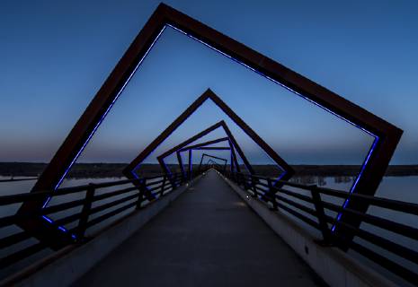 March 22, 2019 - Madrid, Iowa, U.S. - Originally a conduit for rail freight, but now a decomissioned railroad line, the High Trestle Trail Bridge is part of the 25-mile Trestle Trail path for bikers, hikers and horseback riders. The artistic, spiral steel frames springing up from the road bed are a nod to the shape of the timbers placed in former central Iowa coal mines. Madrid U.S. - ZUMAce6_ 20190322_zaf_ce6_021 Copyright: xBrianxCahnx