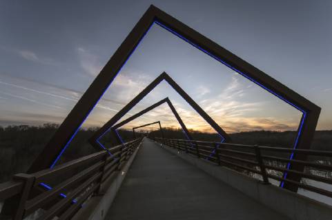 March 22, 2019 - Madrid, Iowa, U.S. - Originally a conduit for rail freight, but now a decomissioned railroad line, the High Trestle Trail Bridge is part of the 25-mile Trestle Trail path for bikers, hikers and horseback riders. The artistic, spiral steel frames springing up from the road bed are a nod to the shape of the timbers placed in former central Iowa coal mines. Madrid U.S. - ZUMAce6_ 20190322_zaf_ce6_019 Copyright: xBrianxCahnx