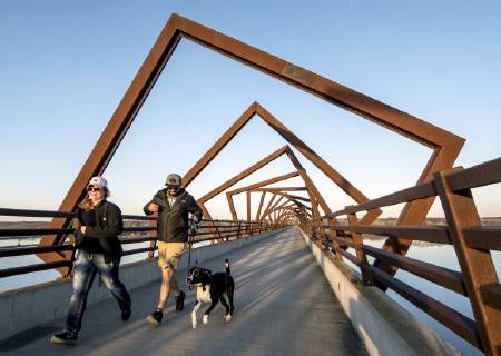 March 22, 2019 - Madrid, Iowa, U.S. - Originally a conduit for rail freight, but now a decomissioned railroad line, the High Trestle Trail Bridge is part of the 25-mile Trestle Trail path for bikers, hikers and horseback riders. The artistic, spiral steel frames springing up from the road bed are a nod to the shape of the timbers placed in former central Iowa coal mines. Madrid U.S. - ZUMAce6_ 20190322_zaf_ce6_015 Copyright: xBrianxCahnx