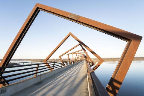 March 22, 2019 - Madrid, Iowa, U.S. - Originally a conduit for rail freight, but now a decomissioned railroad line, the High Trestle Trail Bridge is part of the 25-mile Trestle Trail path for bikers, hikers and horseback riders. The artistic, spiral steel frames springing up from the road bed are a nod to the shape of the timbers placed in former central Iowa coal mines. Madrid U.S. - ZUMAce6_ 20190322_zaf_ce6_013 Copyright: xBrianxCahnx