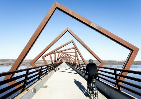 March 22, 2019 - Madrid, Iowa, U.S. - Originally a conduit for rail freight, but now a decomissioned railroad line, the High Trestle Trail Bridge is part of the 25-mile Trestle Trail path for bikers, hikers and horseback riders. The artistic, spiral steel frames springing up from the road bed are a nod to the shape of the timbers placed in former central Iowa coal mines. Madrid U.S. - ZUMAce6_ 20190322_zaf_ce6_002 Copyright: xBrianxCahnx