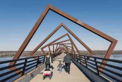 March 22, 2019 - Madrid, Iowa, U.S. - Originally a conduit for rail freight, but now a decomissioned railroad line, the High Trestle Trail Bridge is part of the 25-mile Trestle Trail path for bikers, hikers and horseback riders. The artistic, spiral steel frames springing up from the road bed are a nod to the shape of the timbers placed in former central Iowa coal mines. Madrid U.S. - ZUMAce6_ 20190322_zaf_ce6_003 Copyright: xBrianxCahnx