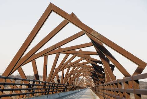March 22, 2019 - Madrid, Iowa, U.S. - Originally a conduit for rail freight, but now a decomissioned railroad line, the High Trestle Trail Bridge is part of the 25-mile Trestle Trail path for bikers, hikers and horseback riders. The artistic, spiral steel frames springing up from the road bed are a nod to the shape of the timbers placed in former central Iowa coal mines. Madrid U.S. - ZUMAce6_ 20190322_zaf_ce6_009 Copyright: xBrianxCahnx