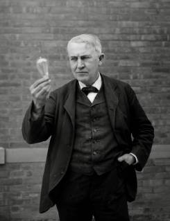 Inventor and physicist Thomas Alva Edison looking at his light bulb invention, circa (1911) File Reference 1003_825THA Hollywood CA USA  Copyright: xCinemaxLegacyxCollection ThexHollywoodxArchivex 1003_825THA