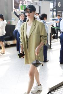 Chinese actress Zhong Chuxi arrives at the Shanghai Hongqiao International Airport before departure in Shanghai, China, 23 May 2019. Handbag: Louis Vuitton Zhong Chuxi arrives at Shanghai airport before departure bjl9767094