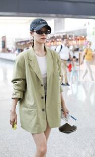 Chinese actress Zhong Chuxi arrives at the Shanghai Hongqiao International Airport before departure in Shanghai, China, 23 May 2019. Handbag: Louis Vuitton Zhong Chuxi arrives at Shanghai airport before departure bjl9767073