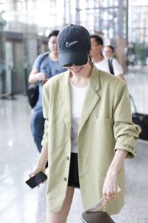 Chinese actress Zhong Chuxi arrives at the Shanghai Hongqiao International Airport before departure in Shanghai, China, 23 May 2019. Handbag: Louis Vuitton Zhong Chuxi arrives at Shanghai airport before departure bjl9767078