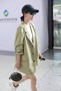 Chinese actress Zhong Chuxi arrives at the Shanghai Hongqiao International Airport before departure in Shanghai, China, 23 May 2019. Handbag: Louis Vuitton Zhong Chuxi arrives at Shanghai airport before departure bjl9767080