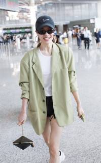 Chinese actress Zhong Chuxi arrives at the Shanghai Hongqiao International Airport before departure in Shanghai, China, 23 May 2019. Handbag: Louis Vuitton Zhong Chuxi arrives at Shanghai airport before departure bjl9767082