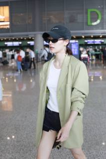 Chinese actress Zhong Chuxi arrives at the Shanghai Hongqiao International Airport before departure in Shanghai, China, 23 May 2019. Handbag: Louis Vuitton Zhong Chuxi arrives at Shanghai airport before departure bjl9767087