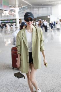 Chinese actress Zhong Chuxi arrives at the Shanghai Hongqiao International Airport before departure in Shanghai, China, 23 May 2019. Handbag: Louis Vuitton Zhong Chuxi arrives at Shanghai airport before departure bjl9767083