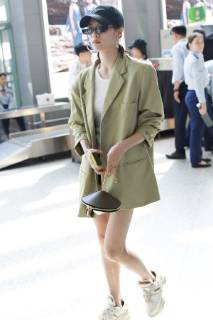 Chinese actress Zhong Chuxi arrives at the Shanghai Hongqiao International Airport before departure in Shanghai, China, 23 May 2019. Handbag: Louis Vuitton Zhong Chuxi arrives at Shanghai airport before departure bjl9767092