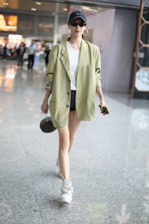 Chinese actress Zhong Chuxi arrives at the Shanghai Hongqiao International Airport before departure in Shanghai, China, 23 May 2019. Handbag: Louis Vuitton Zhong Chuxi arrives at Shanghai airport before departure bjl9766893