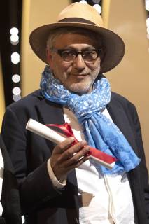 Elia Suleiman accepts the Special Mention Prize for It Must Be Heaven at the award ceremony during the 72nd Cannes Film Festival at the Palais des Festivals on May 25, 2019 in Cannes, France