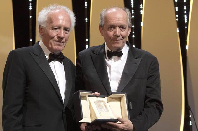 Jean-Pierre Dardenne and Luc Dardenne accept the Best Director Award for their movie Le Jeune Ahmed Young Ahmed at the award ceremony during the 72nd Cannes Film Festival at the Palais des Festivals on May 25, 2019 in Cannes, France
