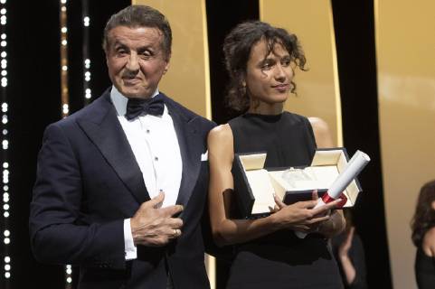 Mati Diop accepts the Grand Prize of the Festival for the movie Atlantique Atlantics) from US actor Sylvester Stallone at the award ceremony during the 72nd Cannes Film Festival at the Palais des Festivals on May 25, 2019 in Cannes, France
