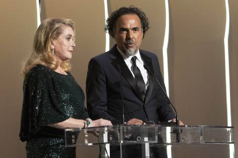 Catherine Deneuve and Alejandro Gonzalez Inarritu at the award ceremony during the 72nd Cannes Film Festival at the Palais des Festivals on May 25, 2019 in Cannes, France