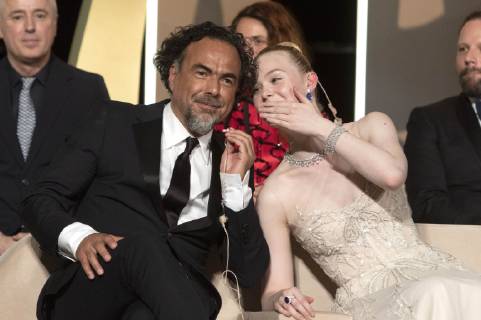 Alejandro Gonzalez Inarritu and Elle Fanning at the award ceremony during the 72nd Cannes Film Festival at the Palais des Festivals on May 25, 2019 in Cannes, France
