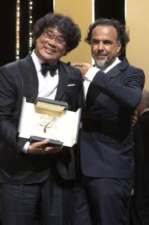 Bong Joon-ho with his Palme d Or (Golden Palm) for the movie Parasite Gisaengchung with President of the Jury Alejandro Gonzalez Inarritu at the award ceremony during the 72nd Cannes Film Festival at the Palais des Festivals on May 25, 2019 in Cannes, France