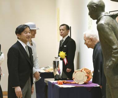 Japan emperor, empress at award ceremony Japan s Emperor Naruhito (L) and Empress Masako talk with Tadao Kamei, a drummer for Noh plays, as he wins the Japan Art Academy award in Tokyo on June 24, 2019. (Pool photo) 