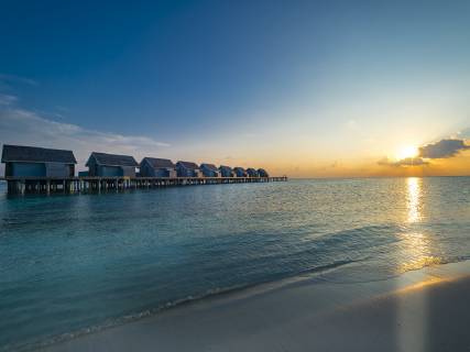 Maledives, Ross Atoll, water bungalows at sunset AMF06906