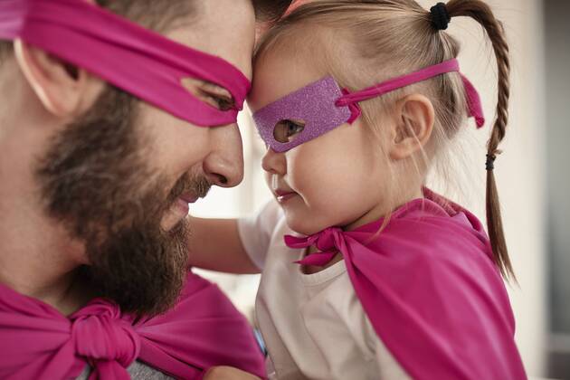 Father and daughter playing super hero and superwoman model released Symbolfoto property released  ZEDF02511