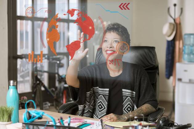  Smiling Professional Woman Operating a Futuristic Computer Screen ,model released, Symbolfoto,property released  Copyright: xCreatistax Panthermedia25674431