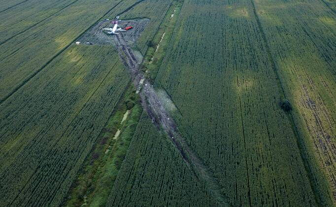 MOSCOW REGION, RUSSIA - AUGUST 16, 2019: An aerial view of the Ural Airlines Airbus A321 plane in a cornfield near Zhukovsky International Airport. The aircraft bound for Simferopol made an emergency landing due to an engine fire on August 15, 2019. Dmitry Golubovich TASS  TS0B6B71